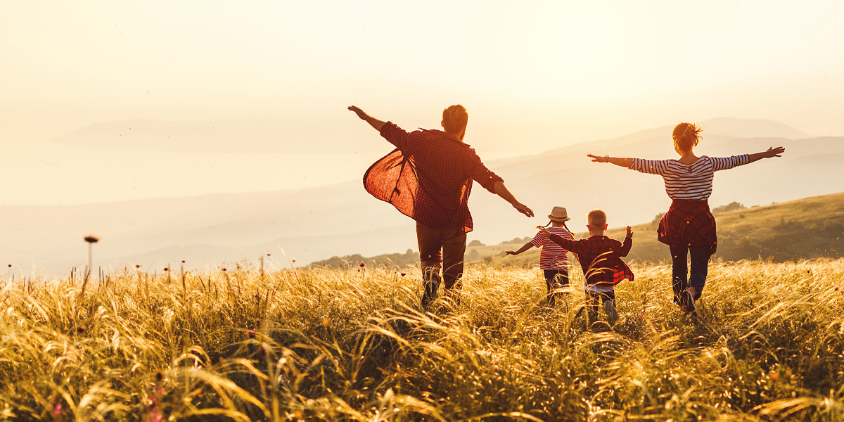 Family running through open field