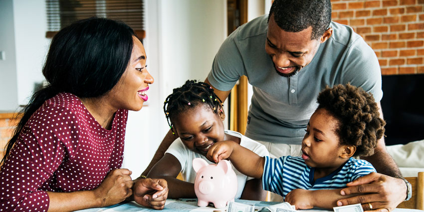 family adding to piggy bank