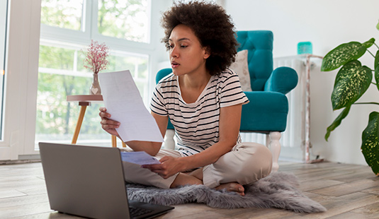 Woman looking at her bills